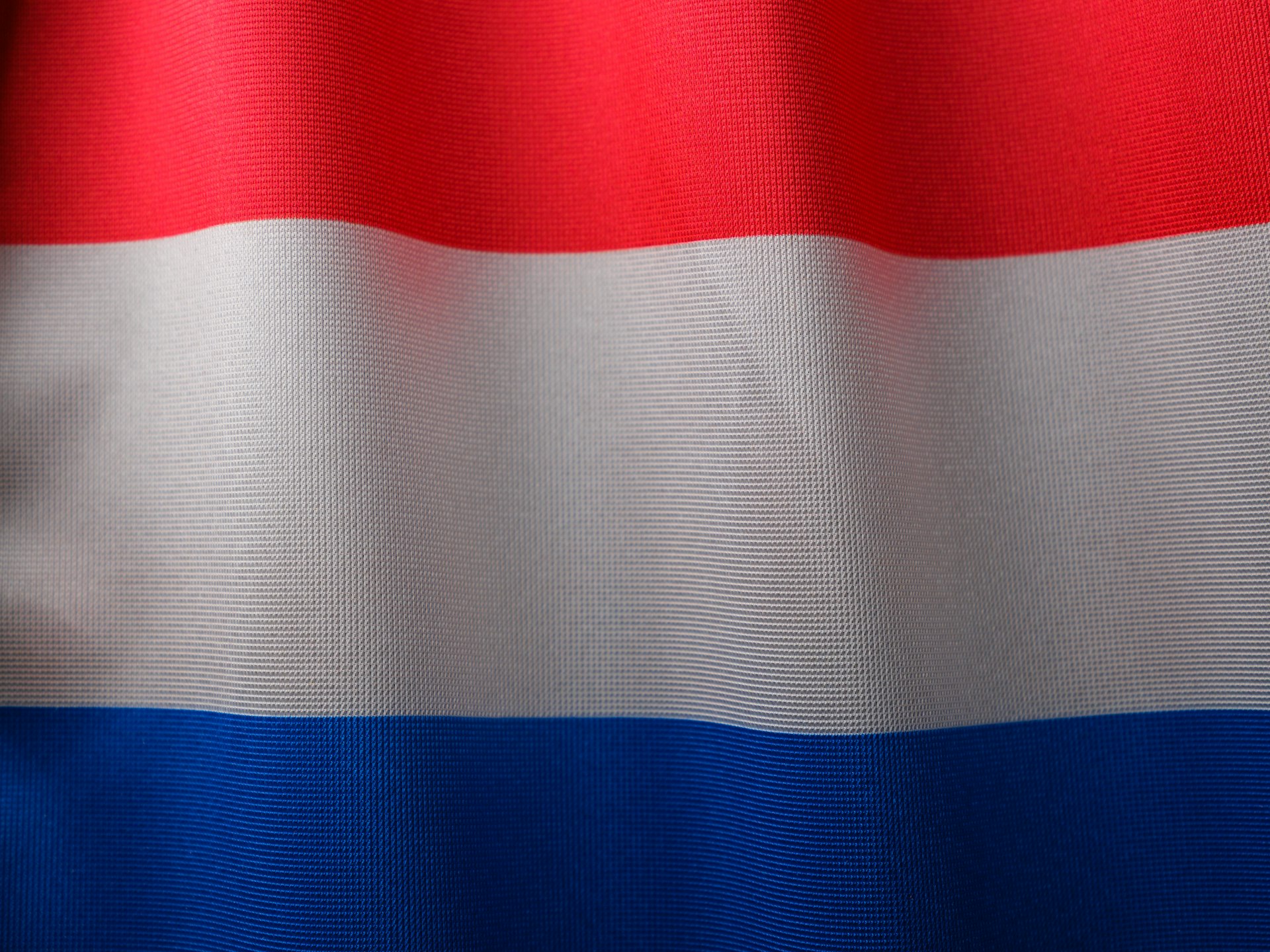 a close up of a red white and blue flag